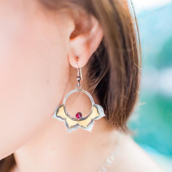 Lotus Hoop Earrings with Garnet photographed on a model side view