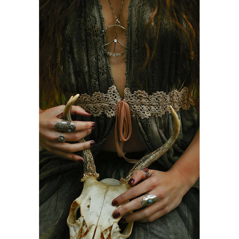 Turquoise Flower Statement Ring stylized photo of the model with a skull