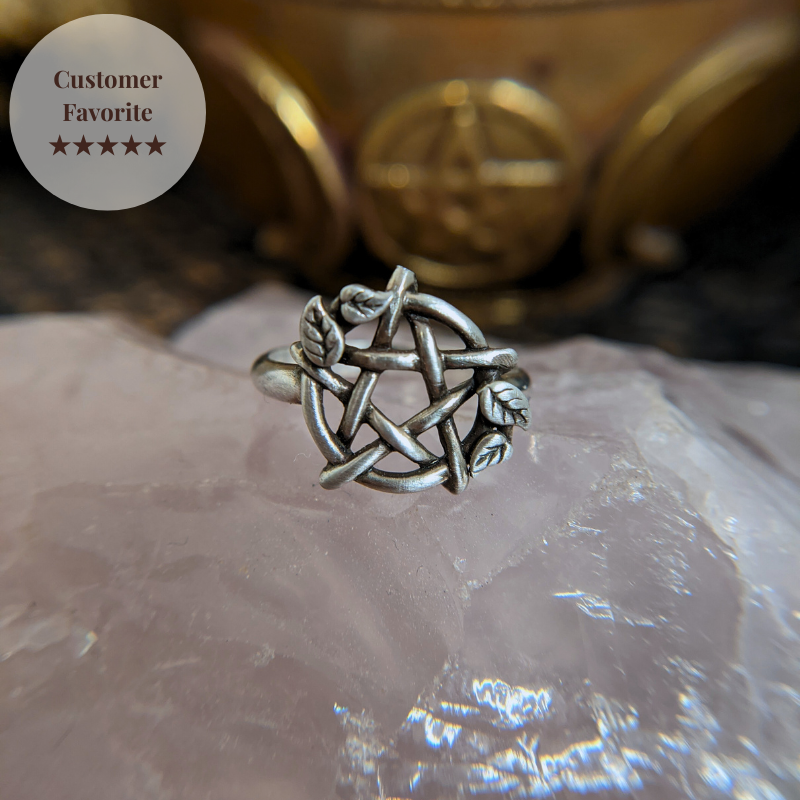 Sterling Silver Pentacle Ring with Leaves sitting on a rose quartz 
