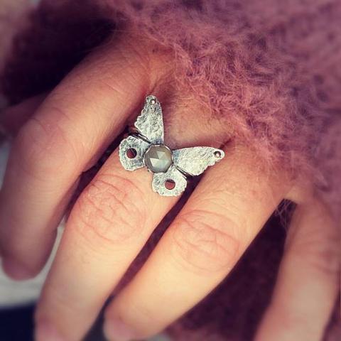 Silver Butterfly Ring with Grey Moonstone photographed on hand 