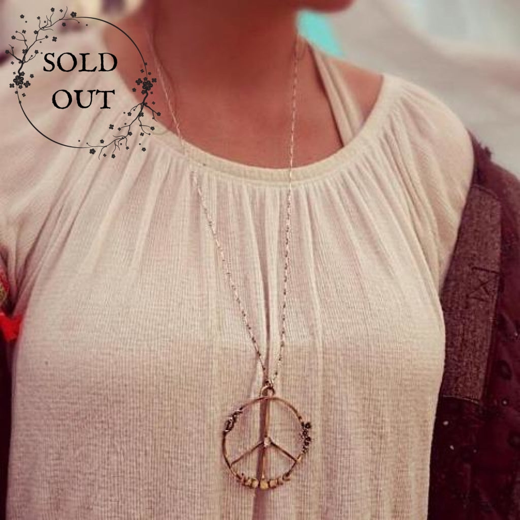 Moon Phases Peace Necklace with Moonstone  worn by a festival goer