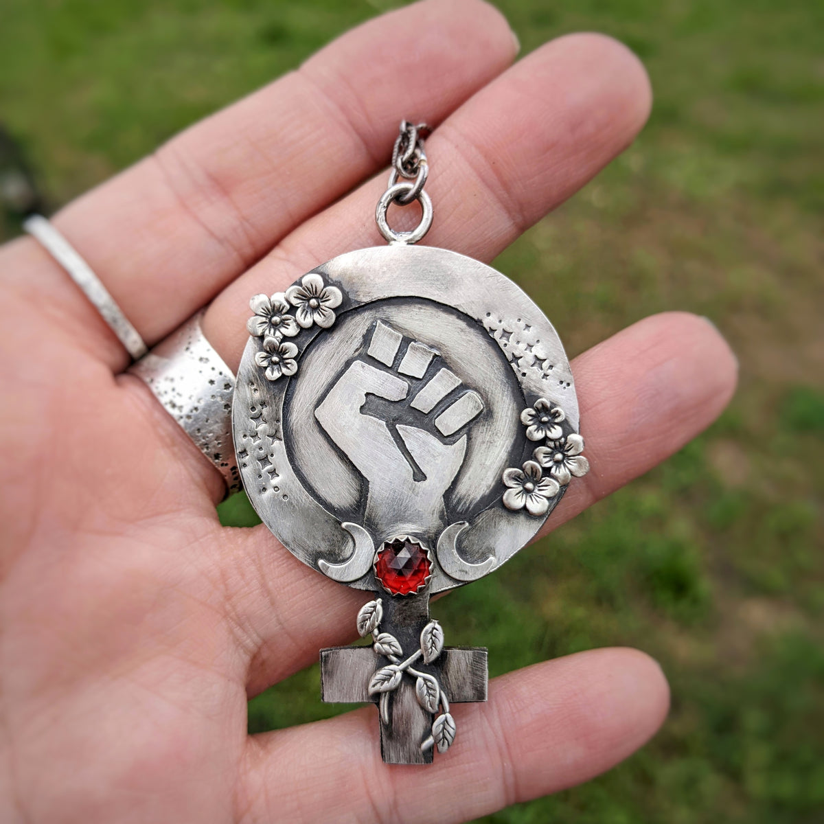 Feminist Fist Necklace with Garnet and Flowers