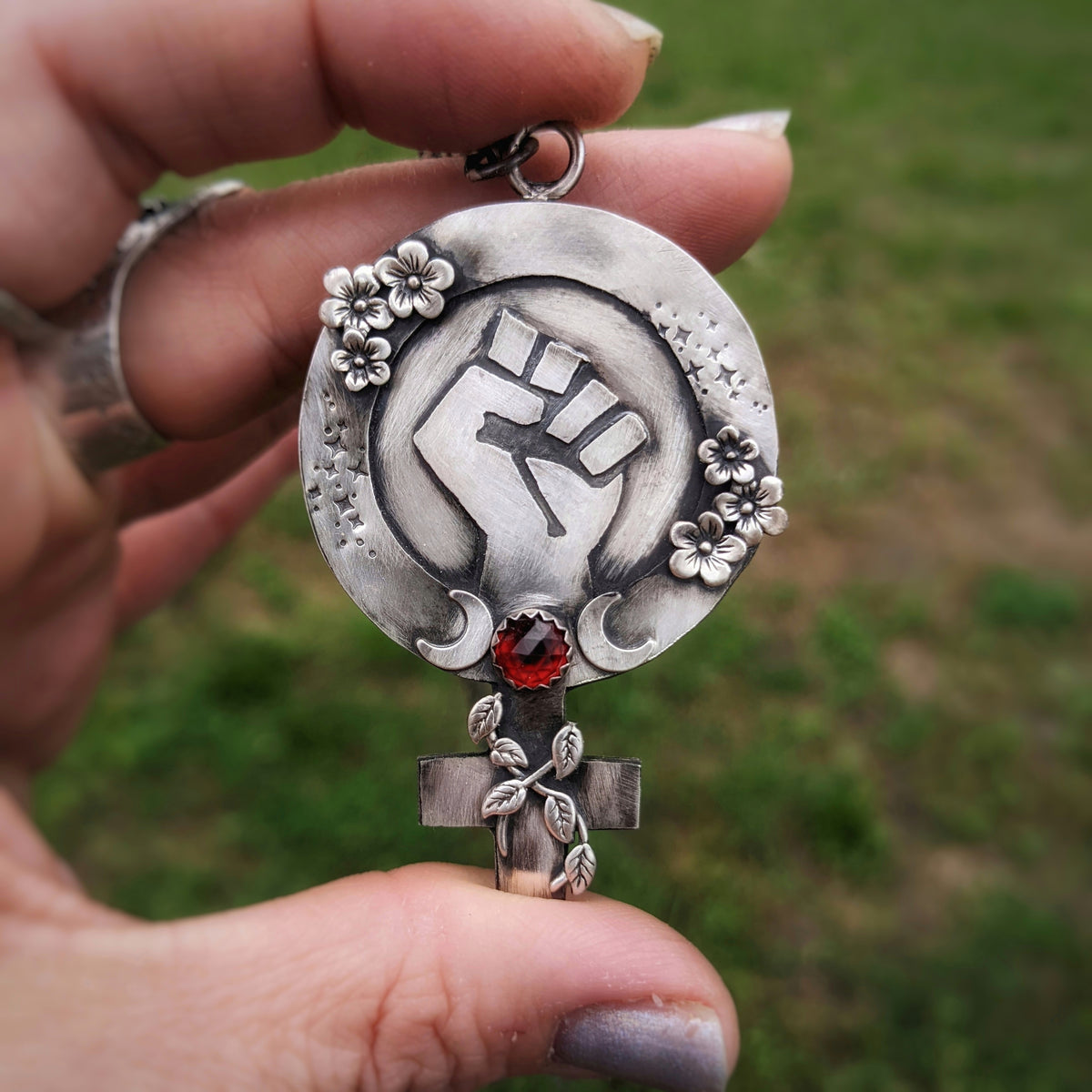 Feminist Fist Necklace with Garnet and Flowers